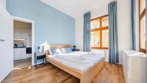 Postel nebo postele na pokoji v ubytování Apartamenty Sun & Snow Międzyzdroje Promenada