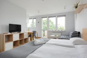 Katil atau katil-katil dalam bilik di Apartments City Center Powiśle