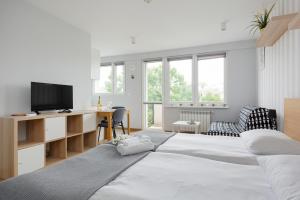 Posteľ alebo postele v izbe v ubytovaní Apartments City Center Powiśle by Noclegi Renters