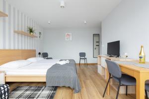 Posteľ alebo postele v izbe v ubytovaní Apartments City Center Powiśle by Noclegi Renters
