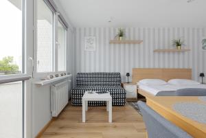 Posteľ alebo postele v izbe v ubytovaní Apartments City Center Powiśle by Noclegi Renters
