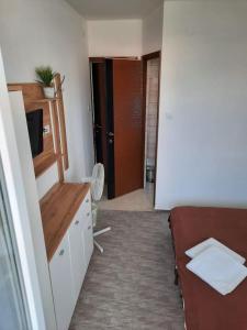 Postel nebo postele na pokoji v ubytování Fiesta Apartman