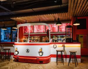 a bar with a pretend bus in a restaurant at !FEST Hotel in Lviv