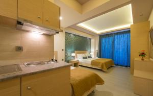 A bed or beds in a room at Zoi Apartments