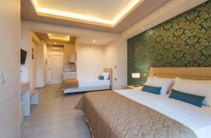 A bed or beds in a room at Zoi Apartments
