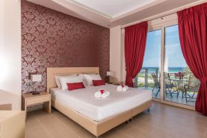 A bed or beds in a room at Zoi Apartments