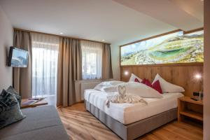 מיטה או מיטות בחדר ב-Hotel Pension Alpengruß