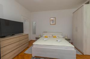 מיטה או מיטות בחדר ב-Studio Apartment Iva