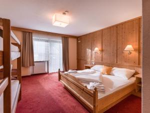 เตียงในห้องที่ Hotel Restaurant Sidan
