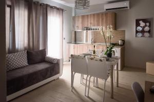 a living room with a couch and a table at Haus Viktoria 2 in Limenas
