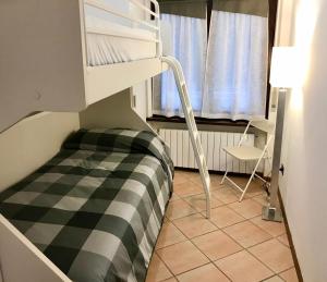 Posteľ alebo postele v izbe v ubytovaní Il Ciottolo Apartments