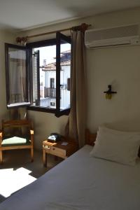 Postel nebo postele na pokoji v ubytování Hotel Maro + 37 fotografií