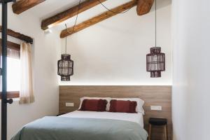 Posteľ alebo postele v izbe v ubytovaní Apartaments la rambla - Garnatxa - 4 persones
