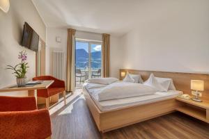 Postel nebo postele na pokoji v ubytování Hotel Törggelehof
