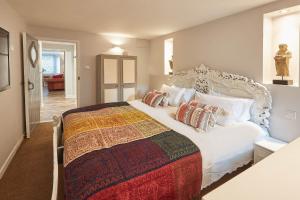 a bedroom with a large white bed with pillows at Host & Stay - In The Key Of Sea in Saltburn-by-the-Sea