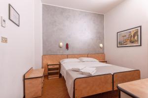 Postel nebo postele na pokoji v ubytování Hotel Albatros
