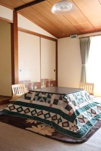 Кровать или кровати в номере Kozaemon