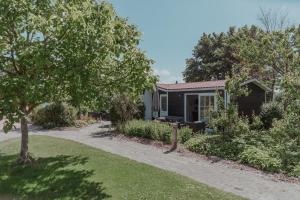 a small house with a pathway leading to it at Ons Buiten in Oostkapelle