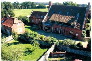 an aerial view of a house with a yard at Dairy Cottage in Cockley Cley