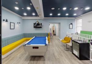 a ping pong table in a waiting room at iQ Ty Willis House in Bangor 3 Min Walk to Bangor Station in Bangor