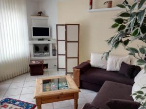 a living room with a couch and a coffee table at Steinatal in Bad Sachsa