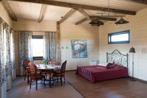 a bedroom with a table and a bed in a room at Teeristi villa in Paslepa +58 photos