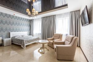 Posteľ alebo postele v izbe v ubytovaní Hotel Premier