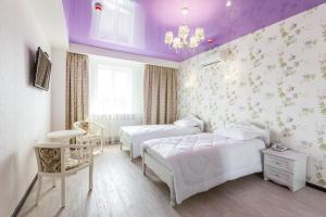 Posteľ alebo postele v izbe v ubytovaní Hotel Premier