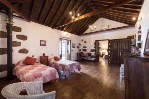 En eller flere senge i et værelse på Casa Rural La Longuera de Tirajana