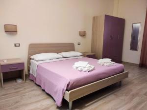 Postel nebo postele na pokoji v ubytování Il Negramaro