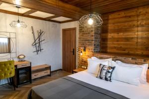 a bedroom with a bed and a desk and lights at Hotel Hunters House in Ezerets +40 photos