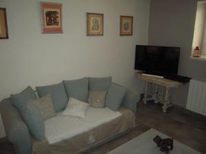 Μια τηλεόραση ή/και κέντρο ψυχαγωγίας στο Appartement Le Chez Soi Riquewihr