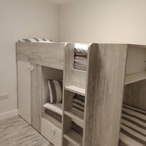 a wooden bunk bed in a room at Crow's Nest Glandore - 4 - Self Catering in Glandore