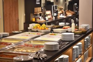 a buffet line with many different types of food at Hotel Element in Lipno nad Vltavou