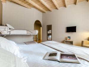 Postel nebo postele na pokoji v ubytování Hotel Nagusi
