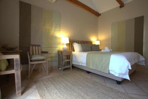 מיטה או מיטות בחדר ב-Apple Cottages