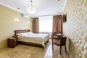 Posteľ alebo postele v izbe v ubytovaní Hotel Premier