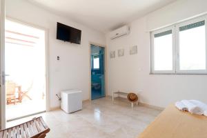 TV a/nebo společenská místnost v ubytování La Finestra Sul Mare