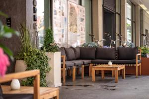 a couch sitting in the side of a building at Hotel Bären am Bundesplatz in Bern +48 photos