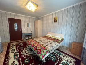 Postel nebo postele na pokoji v ubytování Guest House Ugra