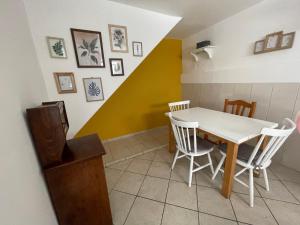 a dining room with a table and chairs at Apartment Chillout House Novalja in Novalja +15 photos