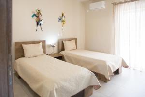 Postel nebo postele na pokoji v ubytování Sea Side Villa