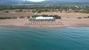 an aerial view of a resort on a beach at The Garden House in Zacharo