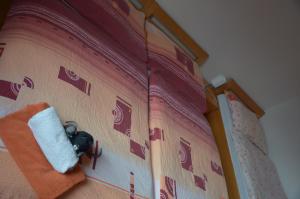 Postel nebo postele na pokoji v ubytování Promenáda Rose Katy - Myši v botě