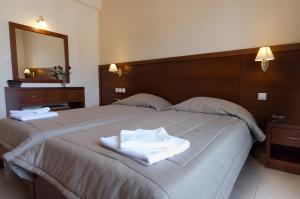 Postel nebo postele na pokoji v ubytování Hotel El Greco