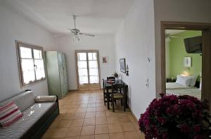 a living room with a couch and a dining room at Violetta Apartments in Neo Klima