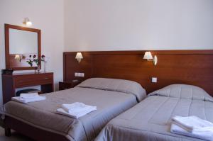 Postel nebo postele na pokoji v ubytování Hotel El Greco