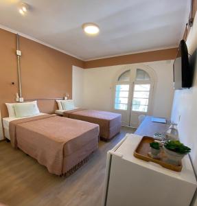 Postel nebo postele na pokoji v ubytování Angatu Hostel