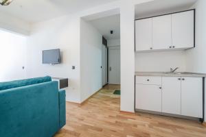TV a/nebo společenská místnost v ubytování Poseidon Apartments + 18 fotografií