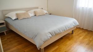 Katil atau katil-katil dalam bilik di Apartment Aria